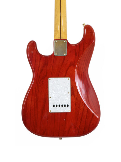 Red Fender MIJ '57 Style Stratocaster guitar featuring a wooden body and white pickguard, made in Japan in 1992.