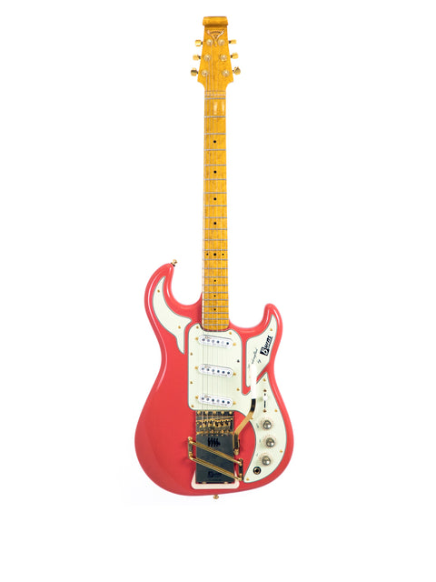 Red electric guitar with white pickguard and maple fretboard isolated on white background.