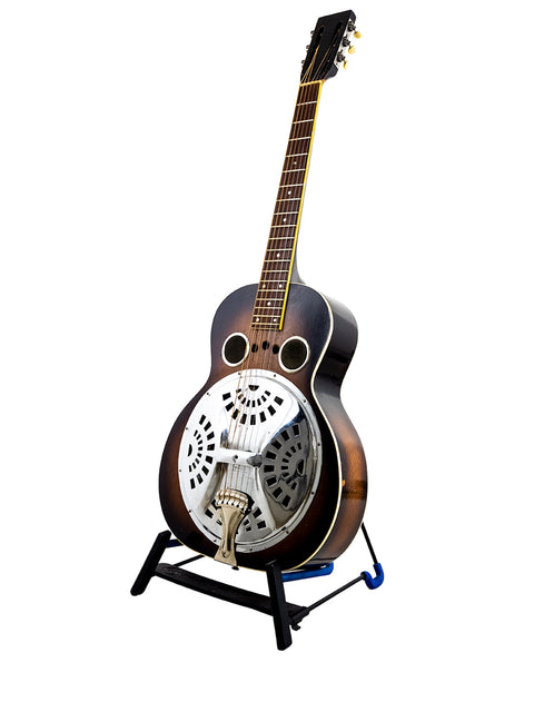Regal Dobro guitar from the 1930s on a stand, highlighted by a stark white background.