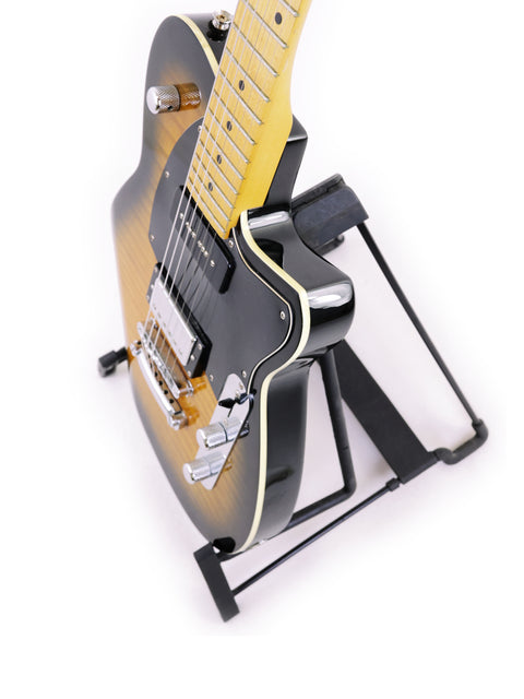 Reverend Double Agent guitar displayed on a black stand, highlighting its elegant features and Korean craftsmanship from 2016.