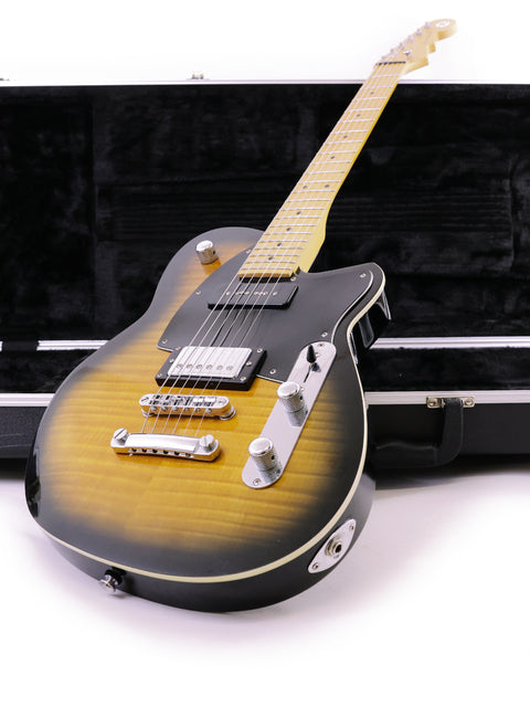 Reverend Double Agent guitar nestled in its case, set against a white backdrop, emphasizing its stylish features.