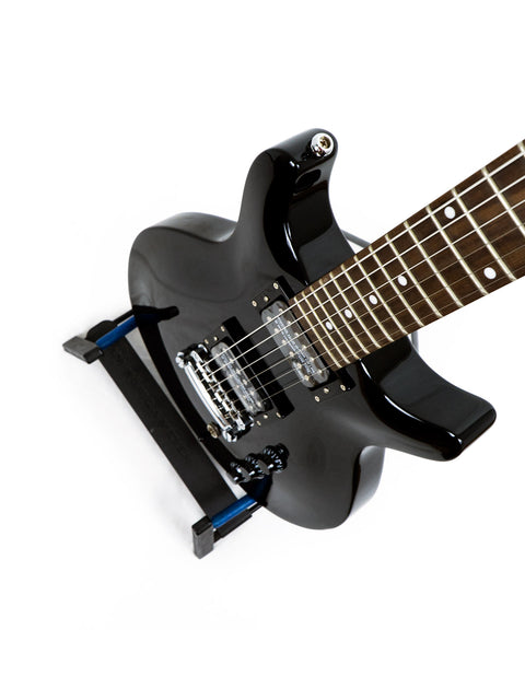 Sleek black electric guitar from the Hamer XT Series LP Jr, displayed on a stand, ideal for aspiring rock stars and collectors.