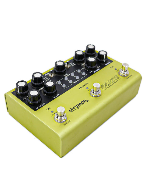 Strymon Volante Magnetic Echo Machine features a yellow pedal shaped like a guitar, blending style and sound.