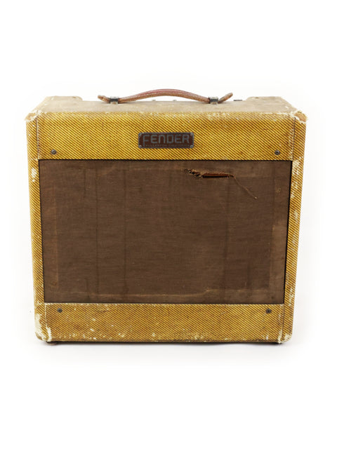 The 1955 Fender Tweed Deluxe Amp 5D3 showcases a stylish brown cover, embodying vintage audio craftsmanship.