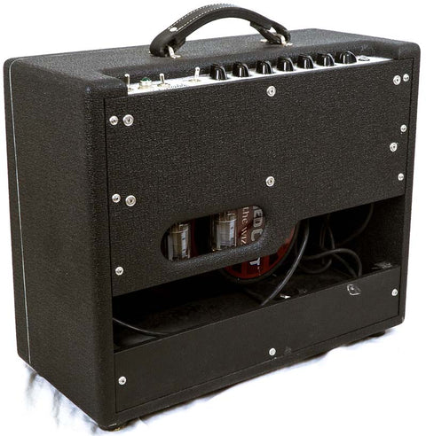 The Carr Rambler Combo Amp, a black guitar amplifier from 2008, housed in a matching black case for a cohesive look.

