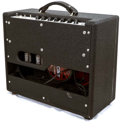 The Carr Rambler Combo Amp, a sleek black guitar amplifier from 2008, showcases a vibrant red handle for easy transport.