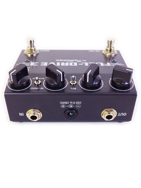 The Fulltone Full-Drive 3 guitar pedal in black and gold is elegantly displayed, highlighting its unique features and quality.
