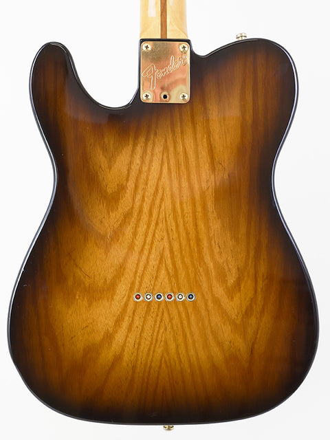 The back of a brown wood Fender Telecaster guitar, highlighting its 40th Anniversary Limited Edition from 1988.

