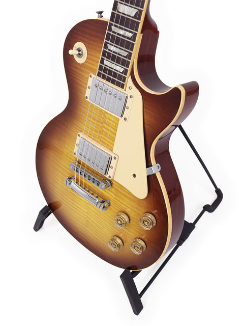 The image features a 2009 Gibson Les Paul Standard electric guitar, known for its iconic shape and stunning craftsmanship.