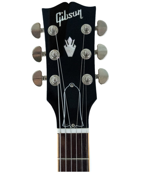 The image features a Gibson Les Paul Standard Jr, highlighting its unique dot inlay and vintage appeal from the USA, 2012.
