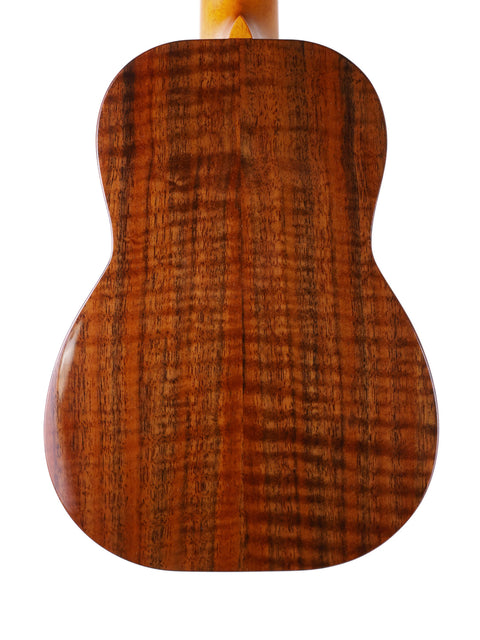 The wooden back of a Kanile’a Platinum Limited Edition Super Concert Ukulele, highlighting its craftsmanship from Hawaii 2017.