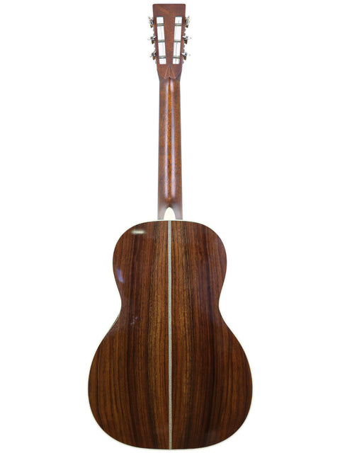 The wooden back of a Martin 00-28VS acoustic guitar, highlighting its craftsmanship, USA-made in 2014.