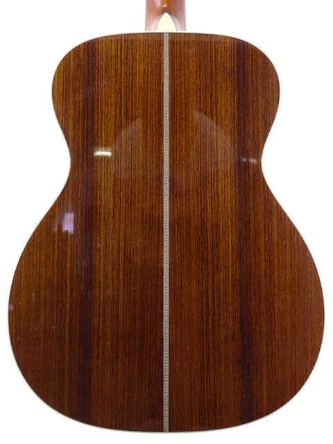 The wooden back of a Martin Custom Shop 000-28 acoustic guitar, highlighting its craftsmanship and design from the USA, 2018.