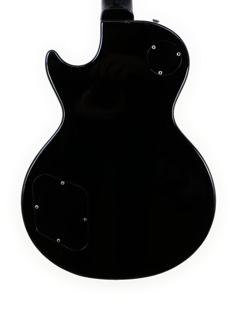 Tokai Les Paul Reborn LS50, a black electric guitar displayed on a clean white background, from Japan, 1979.