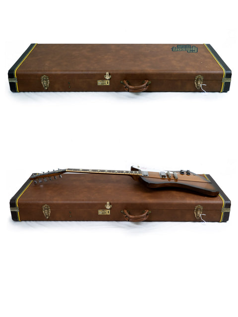 Two guitar cases open to reveal a Gibson Firebird V Reissue from 1991 inside each, highlighting their classic style.