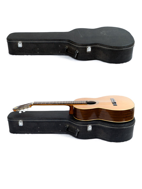 Two guitars, including a Vicente Sanchis Model 34 Classical from 1979, are displayed in a case against a white background.