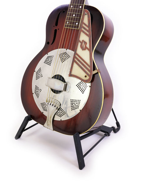 Vintage 1937 National Trojan Resonator guitar with a wooden body, resting on a metal stand, exemplifying classic design.