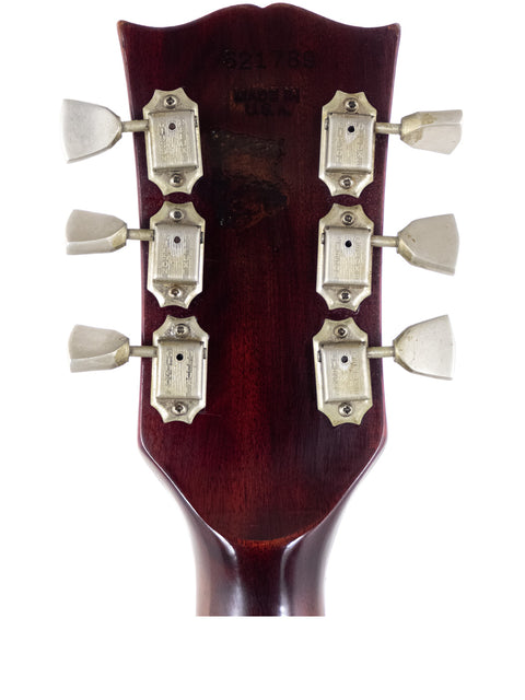 Vintage 1972 Gibson SG Pro electric guitar headstock with four knobs for adjusting sound settings.