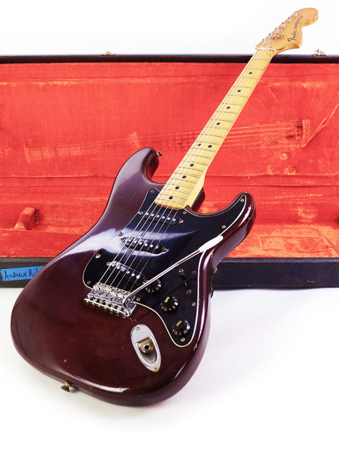 Vintage 1979 Fender Stratocaster electric guitar securely placed in a case, emphasizing its timeless style and quality.