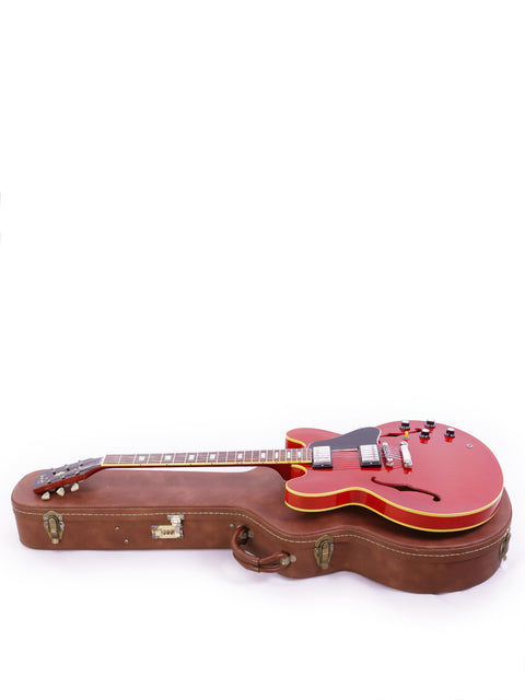 Vintage Gibson ES-335 electric guitar, 1963 Nashville Custom Shop model, known for its iconic semi-hollow body and sound.