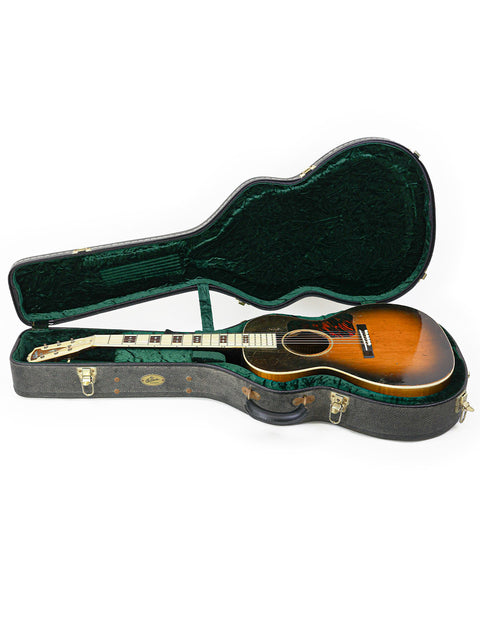 Vintage Gibson L-C 'Century of Progress' guitar in a case, displayed on a white background, highlighting its classic design.