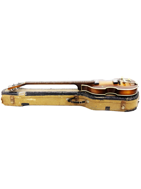 Vintage Hofner 500/1 'Beatle Bass' guitar resting in a case, displayed on a pristine white background for emphasis.