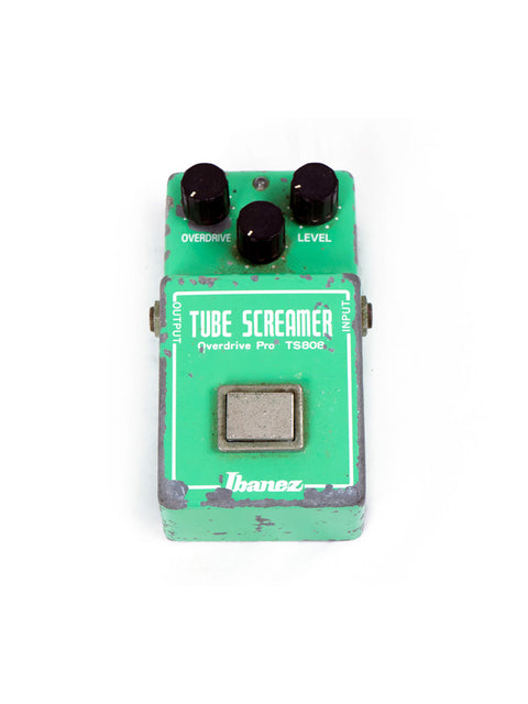 Vintage Ibanez TS-808 green tube screamer pedal on a clean white background, showcasing its classic design from 1979.