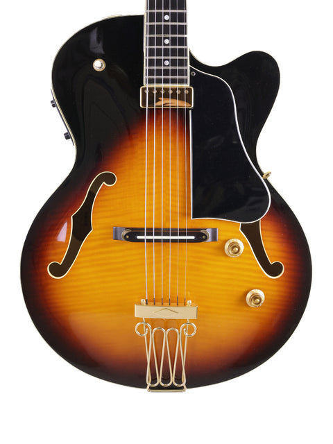 Yamaha AEX1500 guitar from 2004, featuring a striking sunburst finish that highlights its elegant design and craftsmanship.