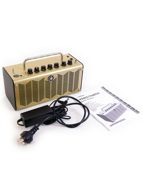 Yamaha THR5 acoustic amplifier in gold, complete with a power cord, highlighting its modern look from Japan, 2020.