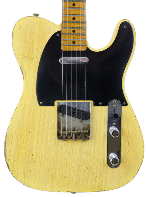Yellow Fender Broadcaster guitar featuring a black pickup, commemorating its 70th Anniversary, designed by Carlos Lopez.
