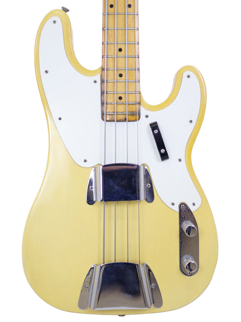 Yellow electric bass guitar with a white body, representing the vintage charm of a 1968 Fender Telecaster Bass.