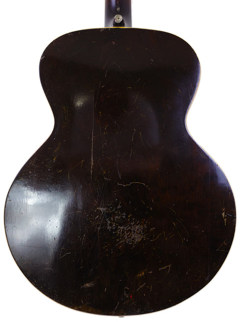 classic 1940s Gibson J-45 electric guitar, known for its rich sound, displayed with a 1938 Gibson ES-150 model.