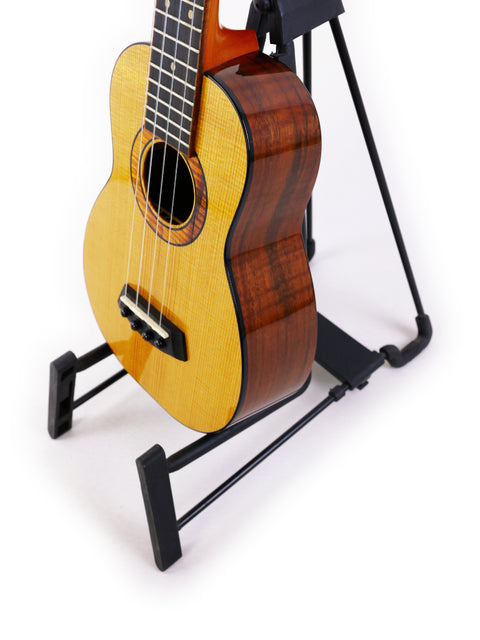 limited edition Kanile’a Super Concert Ukulele from Hawaii 2017 is showcased on a stand.
