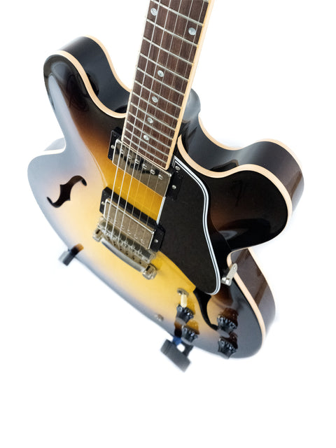 sunburst-finished Gibson Custom ES-335 guitar with dot inlays, displayed against a clean white background.