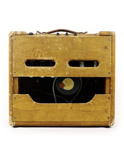 vintage Fender Tweed Deluxe Amp 5D3 from 1955 featuring a playful smiley face design on its front panel.